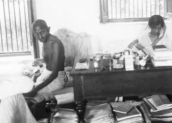 Gandhi and Amrit Kaur working on correspondence
