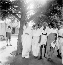 Gandhi walking with coresidents