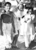 Gandhi walking with Kanu Gandhi and Abha Gandhi